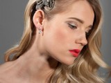 vintage waves on one side accented with a large embellished hairpiece look very refined and chic