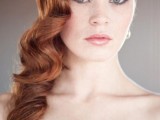 long amber hair in vintage curls looks very elegant and such a structure highlights the color of hair