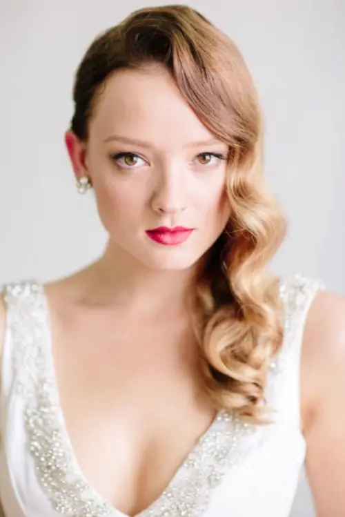 Hollywood waves on one side are a statement hairstyle that will fit a vintage bride