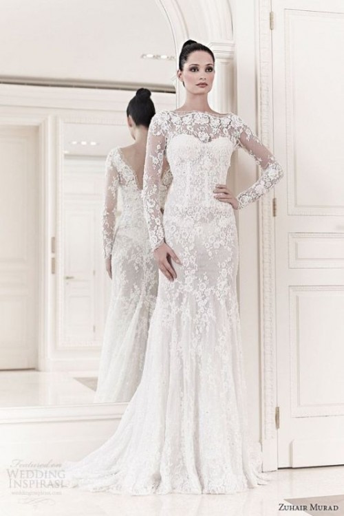 a refined and chic lace applique fitting wedding dress with an illusion neckline, long sleeves and a small train is a very refined idea