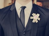 a cool printed ribbon boutonniere shaped as a flower is a gorgeous solution for a modern groom’s look