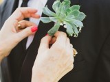 an oversized succulent plus baby’s breath is a lovely boutonniere for a modern groom’s look