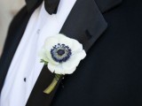 a white anemone wedding boutonniere is a chic and catchy idea for a modern and refined groom’s look