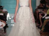 a strapless A-line wedding dress with lace appliques and a tulle skirt plus a metallic belt is adorable