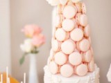 a sophisticated alternative to a usual wedding cake – a white wedding cake with an additional pink macaron tower on top is a gorgeous idea for a fab romantic wedding