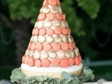 a pretty and bright macaron tower of coral and gold foil macarons is a lovely idea for a bright and fun summer wedding