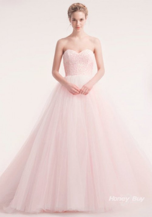 a strapless pink wedding ballgown with an embellished bodice and a layered skirt with a train is a classic idea for a bride who loves a bit of color
