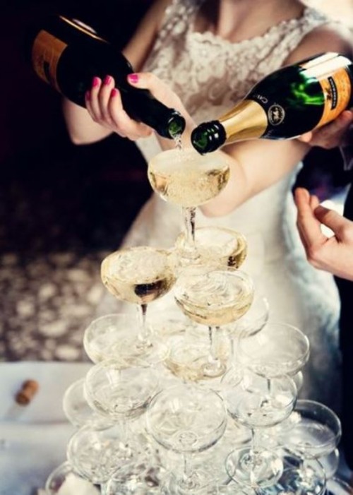 a champagne glass tower is a cool idea for a 1920s rehearsal dinner, bridal shower or wedding