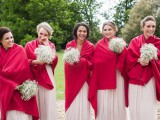 bright red coverups keep the bridesmaids warm and add color to their looks
