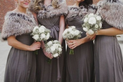 faux fur coverups match the long bridesmaid dresses and keep the girls warm and comfortable