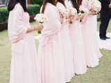 chic light pink pashminas match the bridesmaid dresses and look chic and very girlish