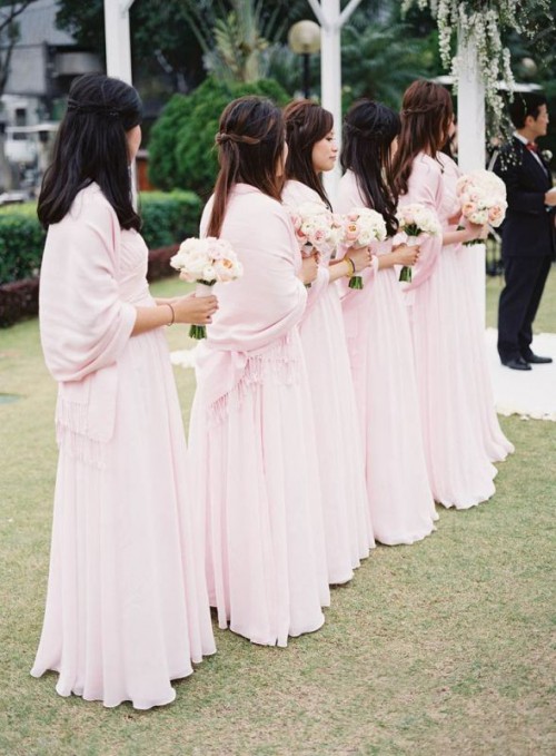 chic light pink pashminas match the bridesmaid dresses and look chic and very girlish
