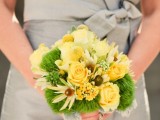 a bright wedding bouquet of yellow roses, billy balls, chamomiles and moss pieces is a bright and sunny idea for a spring or fall bride