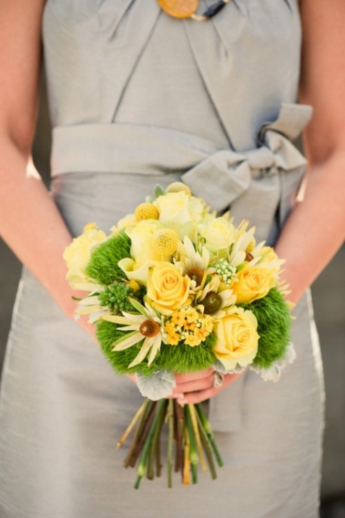a bright wedding bouquet of yellow roses, billy balls, chamomiles and moss pieces is a bright and sunny idea for a spring or fall bride