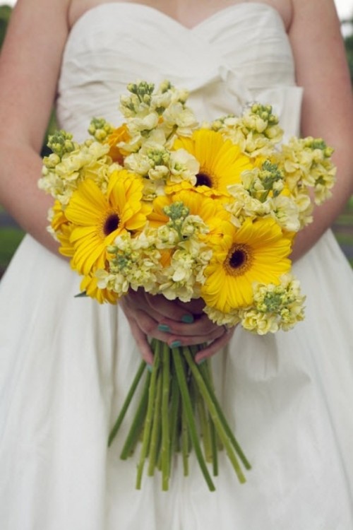 a wedding bouquet of yellow gerberas, yellow roses and white hydrangeas is a lovely idea for a spring or summer bride