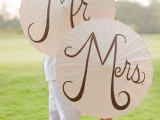 simple Mr and Mrs paper umbrellas are super cute and fun props to use for taking pics