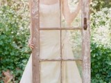 a shabby chic door with glass is a unique wedding photo booth prop that will give vintage chic to your pics