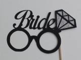 a special prop for the bride – glasses with a diamond and a proper sign