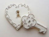 white glazed cookies shaped as a lock and a key are a great idea for a vintage wedding dessert table