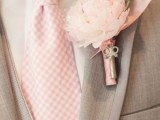 a floral boutonniere with a tiny vintage key