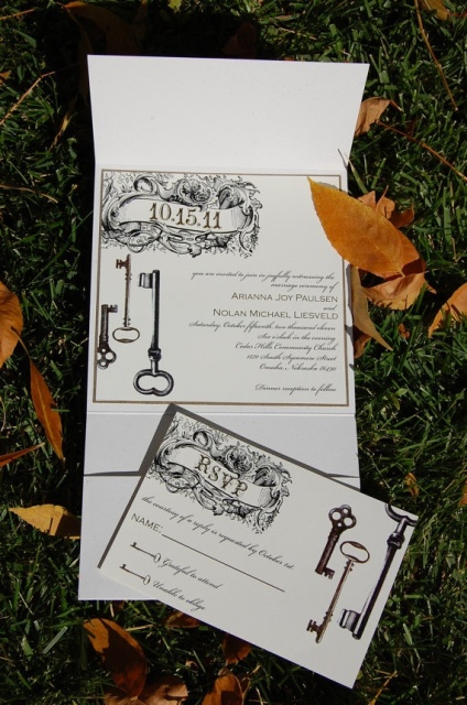 a black and white wedding invitation suite with various prints including vintage keys is a beautiful idea for a vintage-themed wedding
