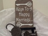 lovely vintage wedding decor of a sign and a large lock and vintage key is a cool idea to easily realize yourself