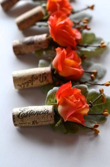 wedding boutonnieres with wine corks and bright blooms and greenery are amazing for vineyard weddings