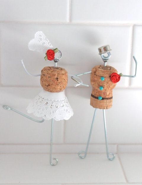 funny cake toppers of wine corks, wire, lace, buttons and fabric blooms can be DIYed by you yourself