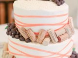 a wedding cake topped with wine corks and grapes will fit a vineyard wedding easily