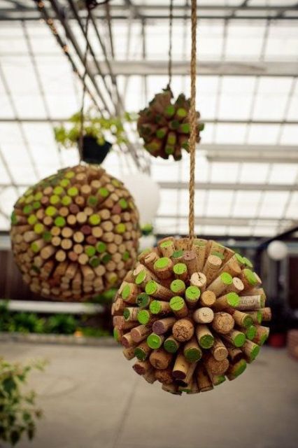 colorful wine cork balls hanging over the reception is a fun and cool wedding decor idea