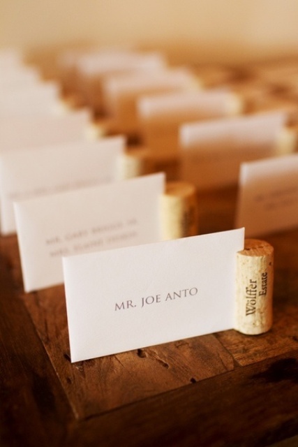 a seating chart done with wine corks and with cards is a fun and cute idea for a vineyard wedding
