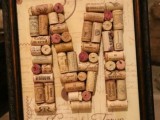 a wine cork monogram in a refined frame is a stylish and easy decoration idea for a vineyard wedding