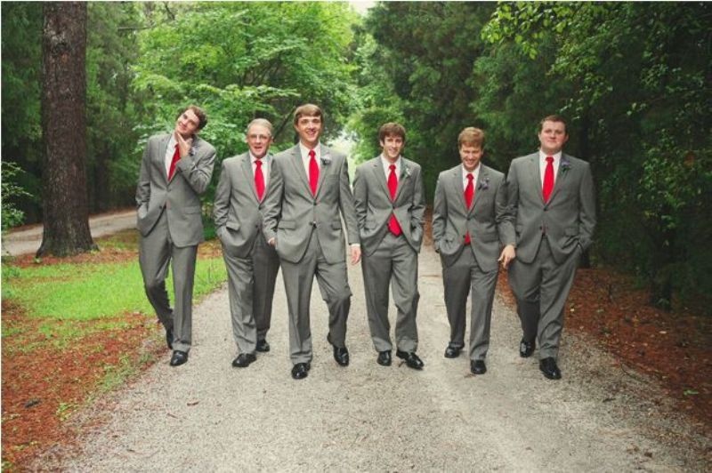 groomsmen wearing grey suits with red ties look very stylish and elegant