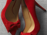 chic red bow heels are great for a bride who wants to add a colorful accent to her look