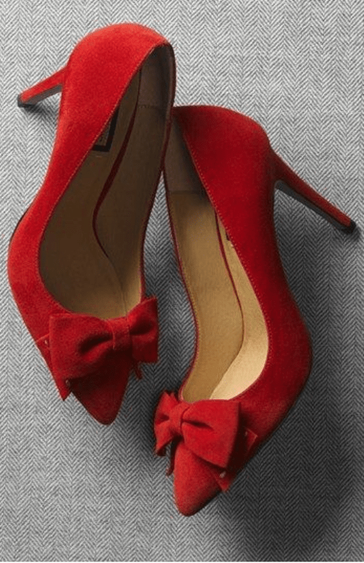 chic red bow heels are great for a bride who wants to add a colorful accent to her look