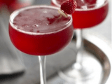 red signature drinks spruced up with little raspberries are amazing for a red and grey winter wedding