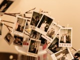 branches with Polaroids is a very cute and chic wedding venue decor idea to try