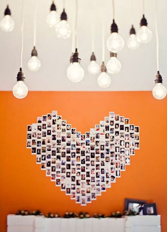 A large heart on the wall fully made of your couple's Polaroids is a very creative wedding or venue backdrop