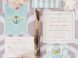 a pretty beach wedding invitation suite with turquoise and white pieces, with stripes, anchors and even an octopus, driftwood and seashells