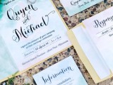 a beautiful green, white and emerald watercolor wedding invitation suite imitates the ocean and looks beautiful