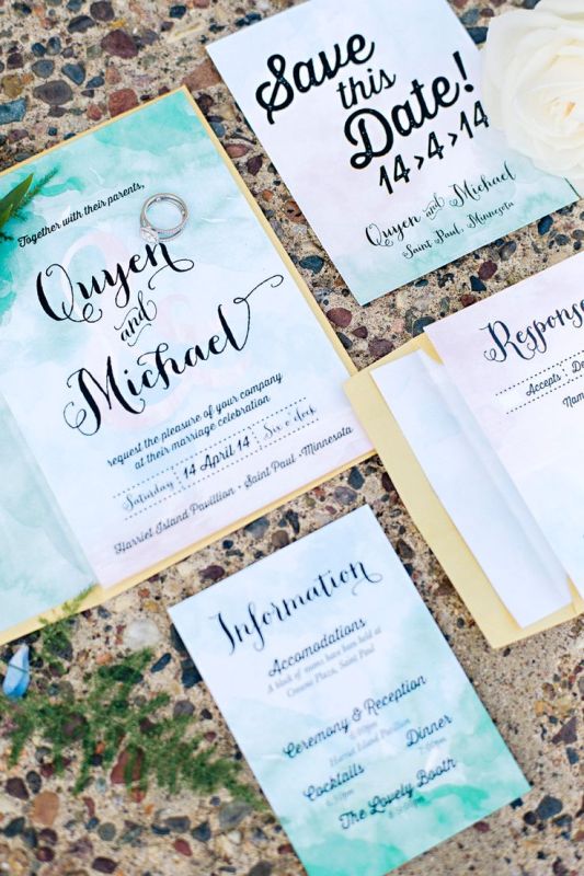 A beautiful green, white and emerald watercolor wedding invitation suite imitates the ocean and looks beautiful