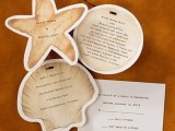 a beautiful tan beach wedding invitation suite with a round, seashell and starfish shaped invitations with black lettering is a very creative and chic idea