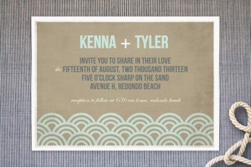 a simple and modern beach wedding invitation of tan paper, with mint wave-inspired prints and navy and mint letters is an easy idea to try