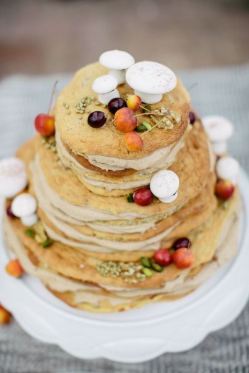 a woodland pancake wedding cake with nuts, seeds, grasses, sugar mushrooms and berries is a gorgeous idea for the fall