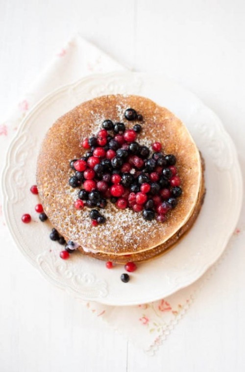 a pancake wedding cake topped with fresh berries and sugar powder is a lovely idea for a woodland or garden wedding