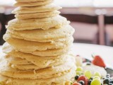 a super simple pancake wedding cake with lots of fresh fruit and berries around and nothign else is a very creative idea for those who don’t liek much sugar