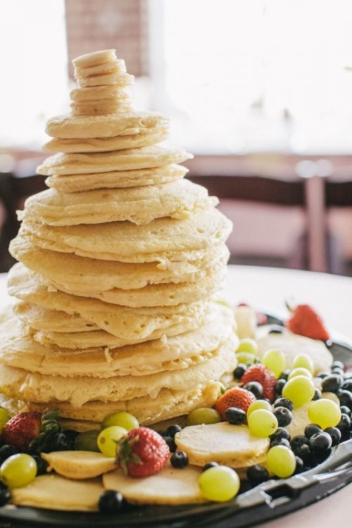 a super simple pancake wedding cake with lots of fresh fruit and berries around and nothign else is a very creative idea for those who don't liek much sugar