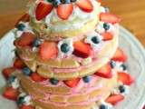 a pancake wedding cake with some pink cream and fresh berries is a gorgeous idea for a modern wedding