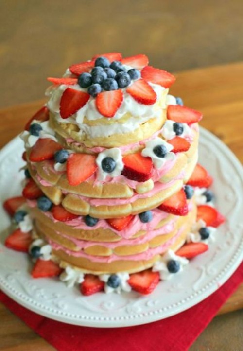 a pancake wedding cake with some pink cream and fresh berries is a gorgeous idea for a modern wedding