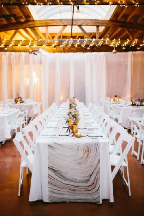 a marble print table runner will give an ultimately modern feel to your wedding tablescape